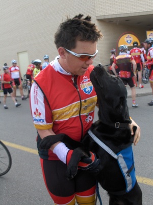 Andy's guide dog, Boston, was the cycling team's unofficial mascot